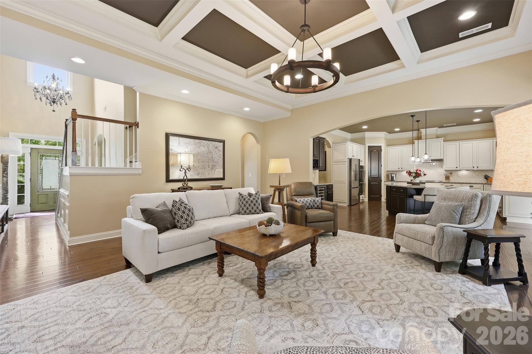 8094 Clems Branch Road Indian Land, SC 29707 - Photo 11 of 38 a living room with furniture kitchen and a chandelier