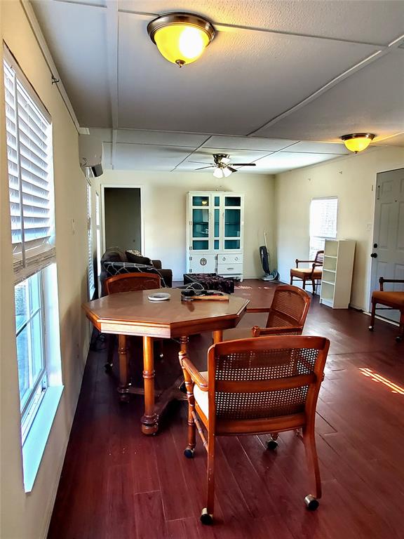 103 Hackberry Lane Roanoke, TX 76262 - Photo 5 of 9 a view of a dining room with furniture window and wooden floor