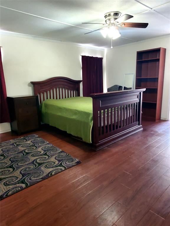 103 Hackberry Lane Roanoke, TX 76262 - Photo 9 of 9 a bedroom with a bed and dresser