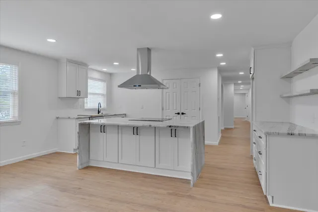 a view of kitchen with wooden floor