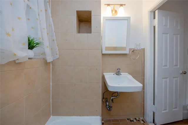 a sink with a mirror