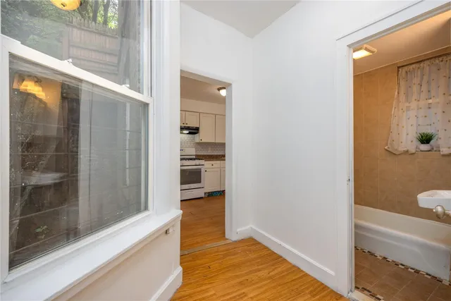 a bathroom with a tub and shower