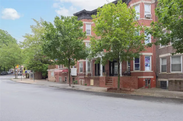 front view of a building with a bench