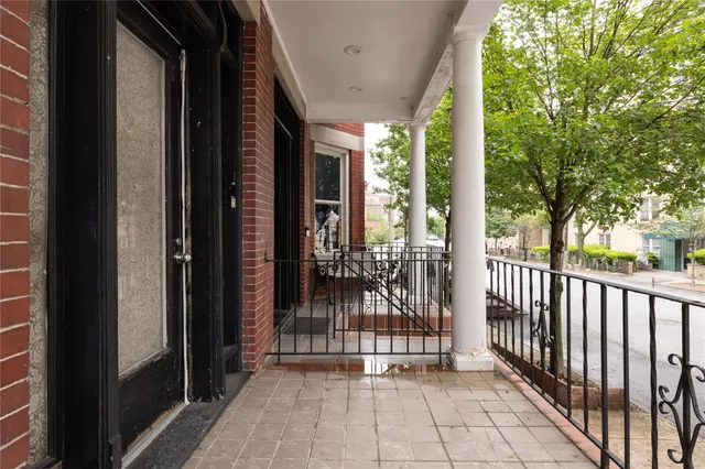 a view of a porch with wooden floor and outdoor space