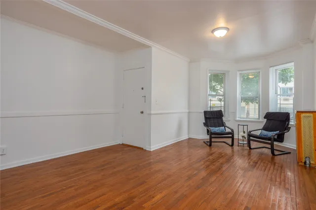 a view of a livingroom with furniture and wooden floor