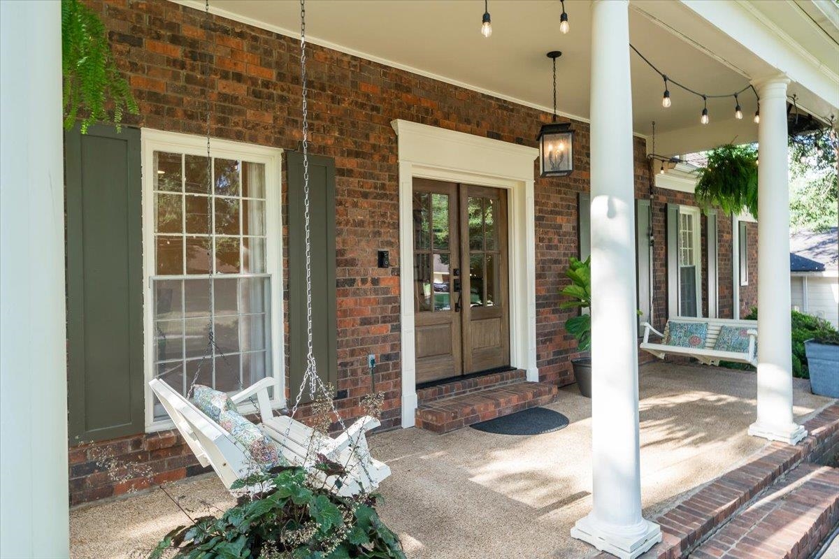 5376 Mason Road Memphis, TN 38120 - Photo 1 of 37 Entrance to property with covered porch, brick siding, and french doors