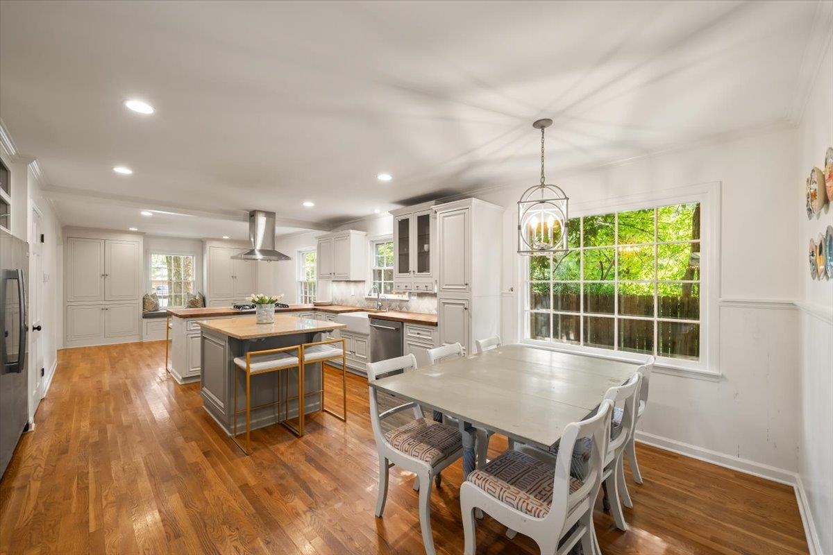5376 Mason Road Memphis, TN 38120 - Photo 17 of 37 Dining area with wood finished floors, recessed lighting, and a chandelier