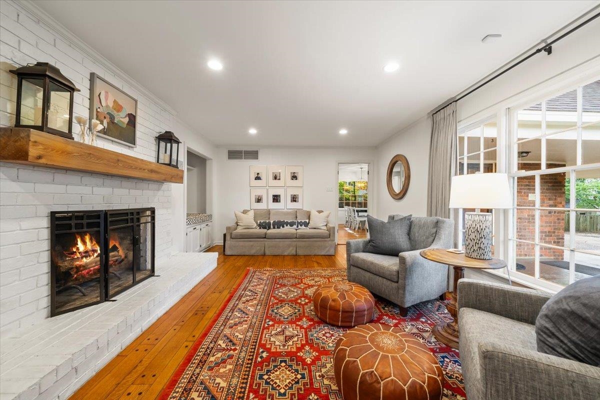 5376 Mason Road Memphis, TN 38120 - Photo 3 of 37 Living room featuring light wood-style flooring, a brick fireplace, and recessed lighting