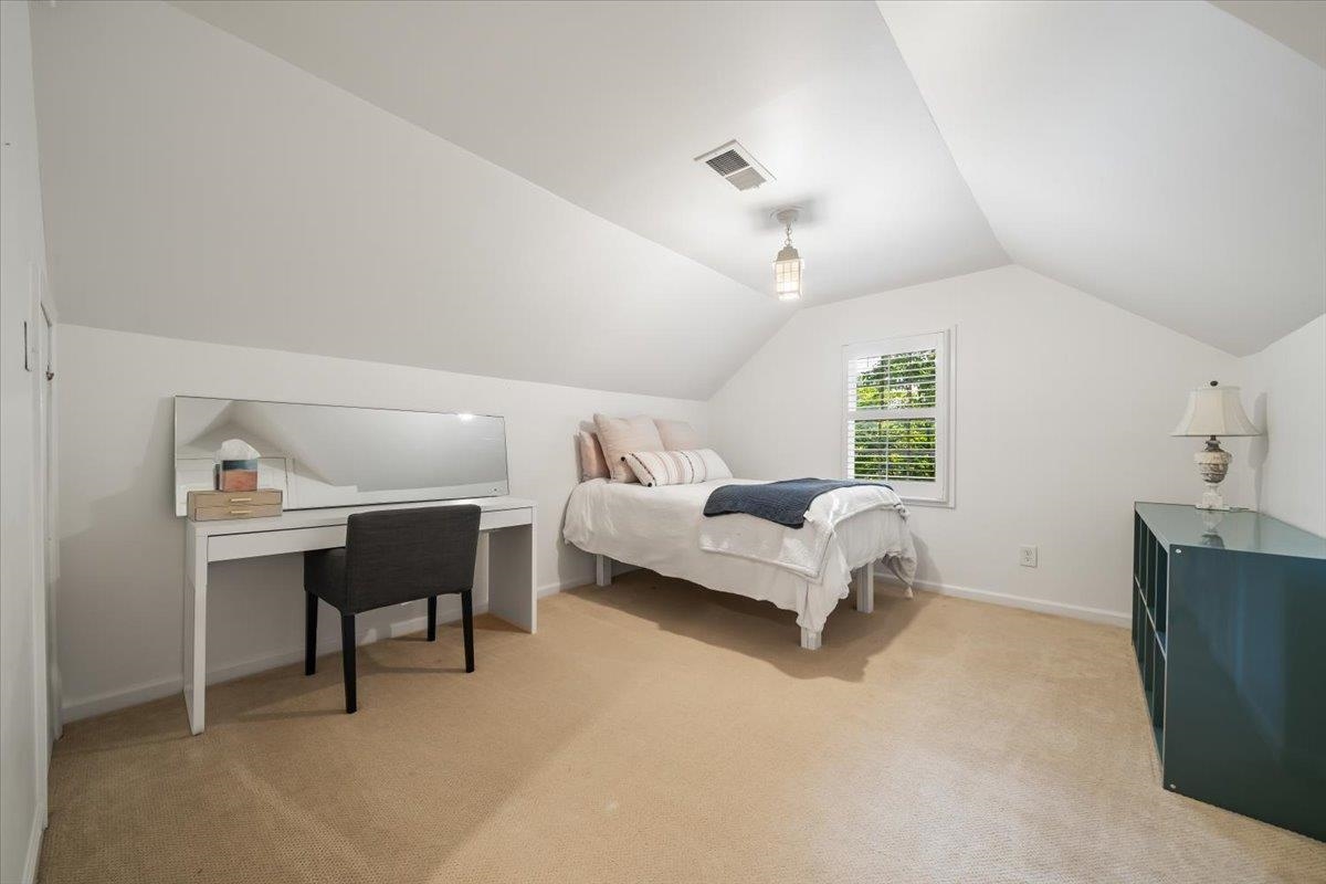 5376 Mason Road Memphis, TN 38120 - Photo 32 of 37 Bedroom featuring light carpet and lofted ceiling