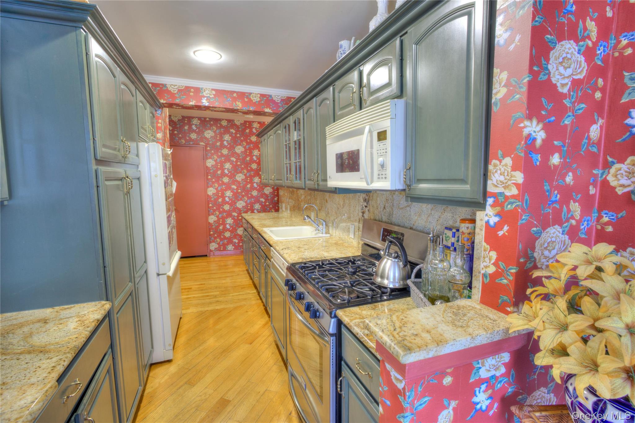 75 South Middle Neck Road, Unit 4G Great Neck, NY 11021 - Photo 12 of 37 a bathroom with a granite countertop sink and a mirror