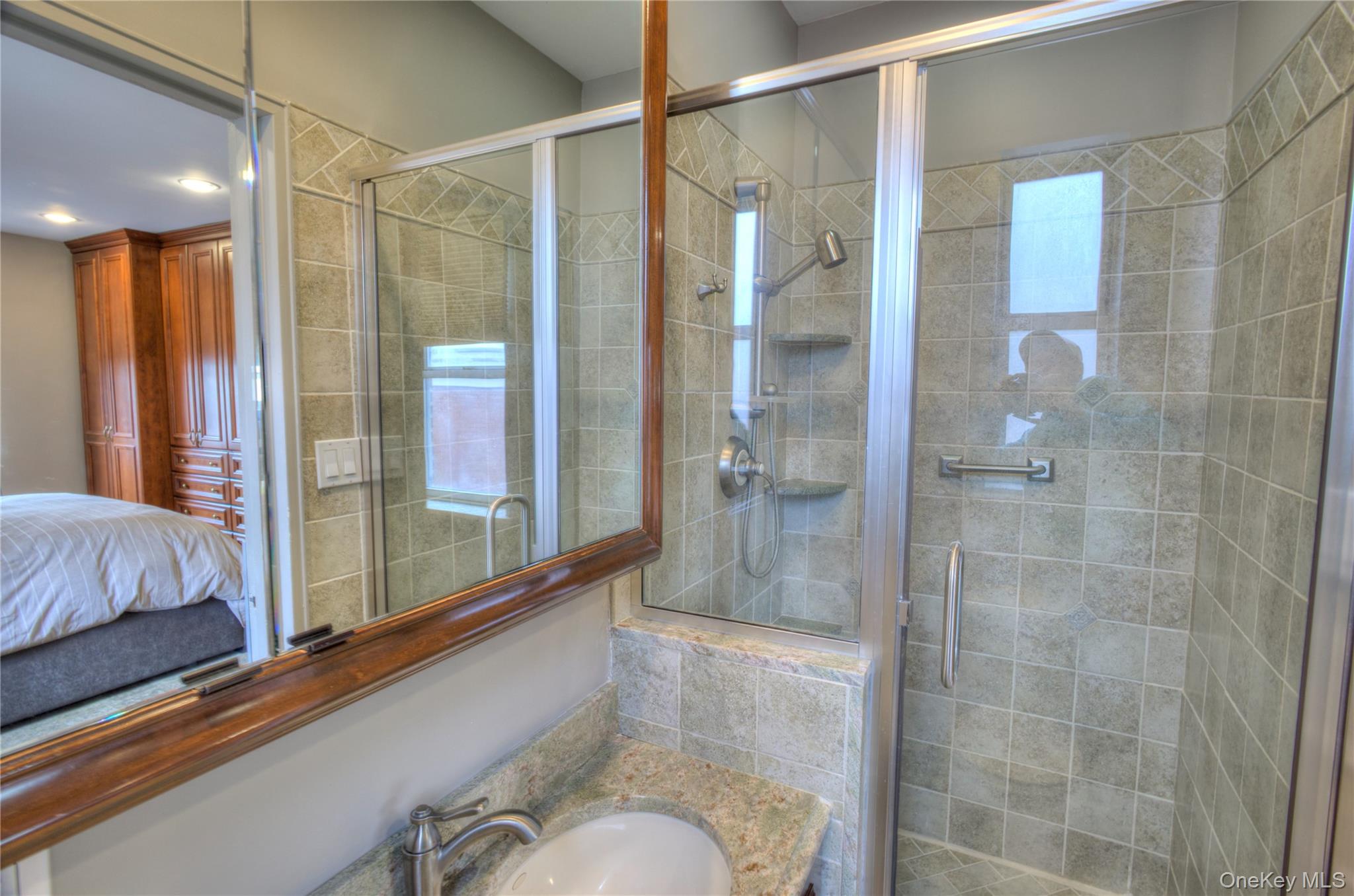 75 South Middle Neck Road, Unit 4G Great Neck, NY 11021 - Photo 13 of 37 a bathroom with a shower and a tub