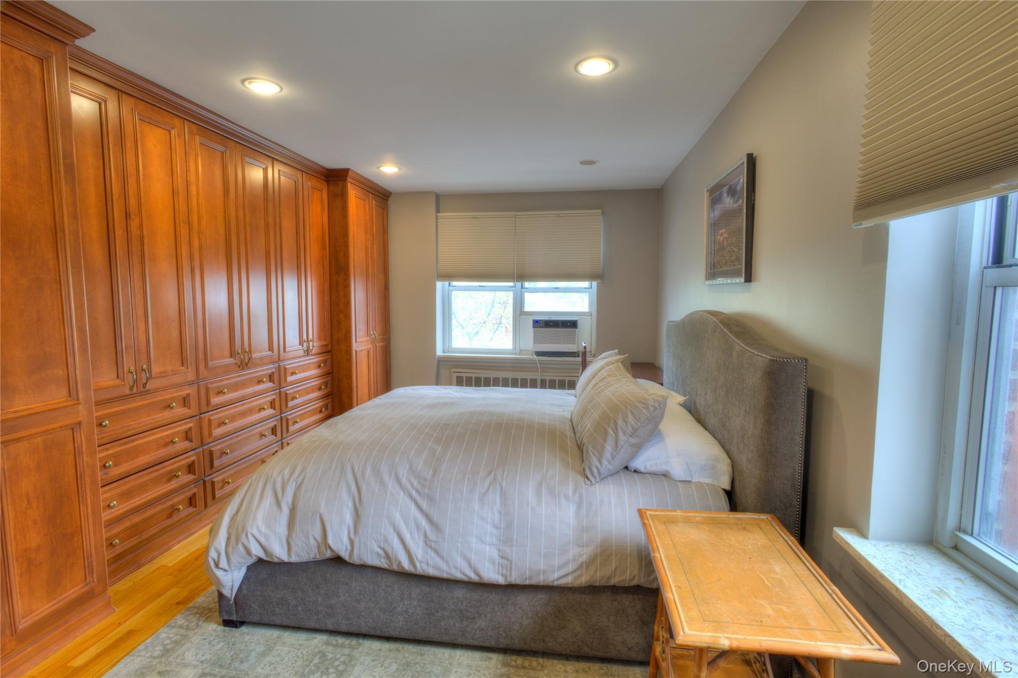 75 South Middle Neck Road, Unit 4G Great Neck, NY 11021 - Photo 14 of 37 a bedroom with a bed and window