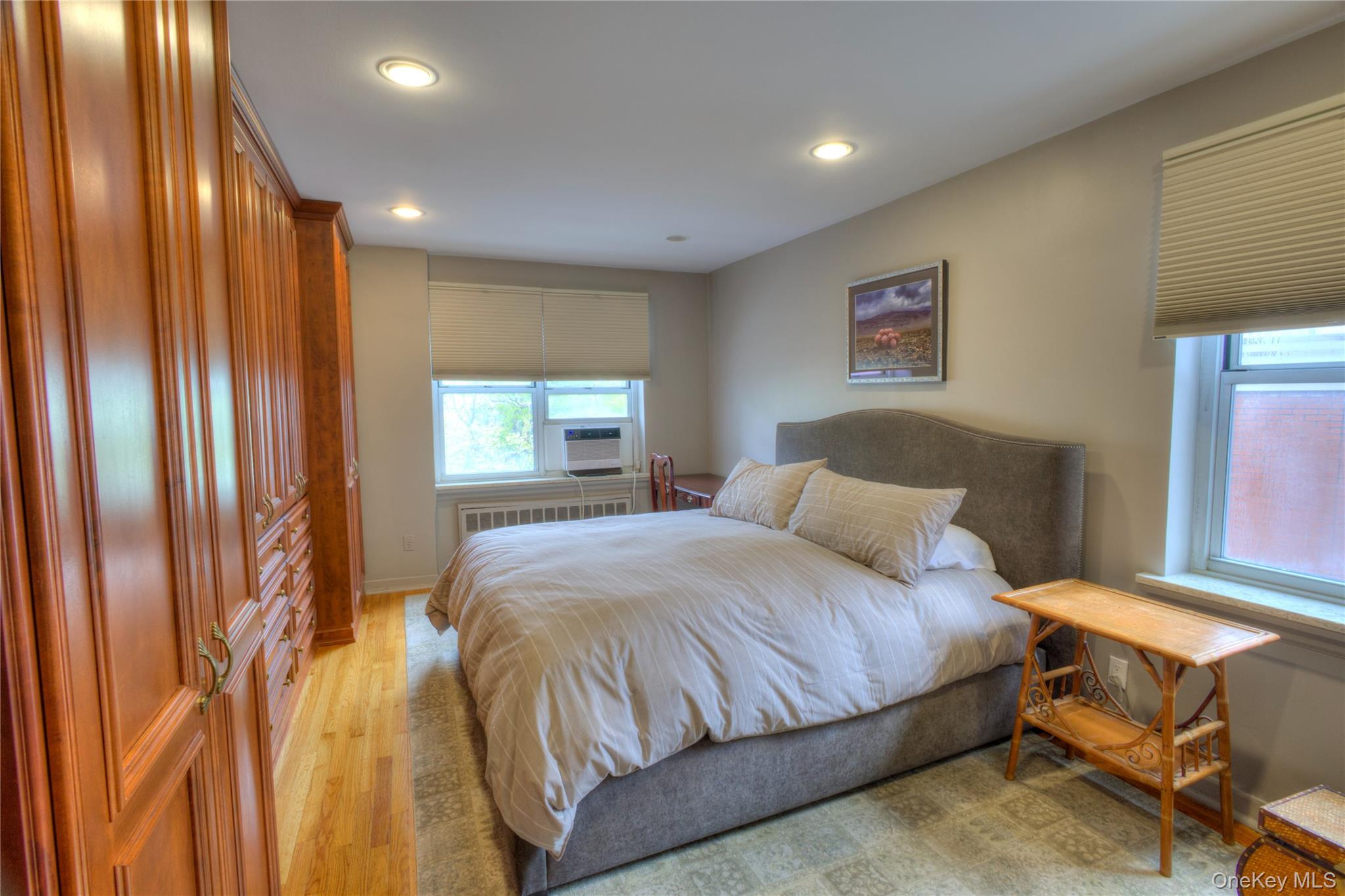 75 South Middle Neck Road, Unit 4G Great Neck, NY 11021 - Photo 15 of 37 a bedroom with a bed and a window