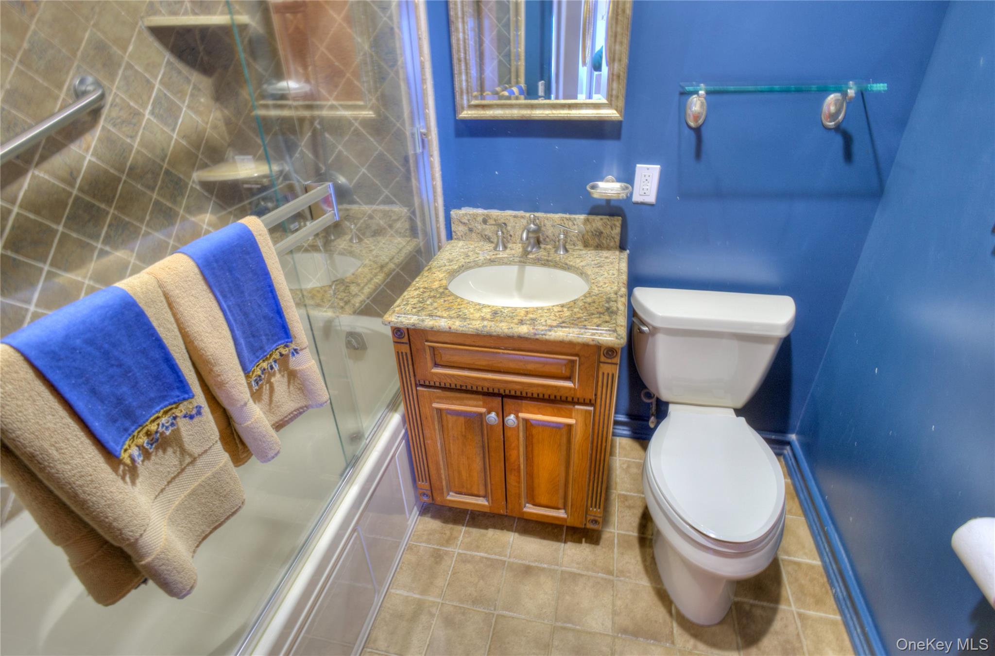 75 South Middle Neck Road, Unit 4G Great Neck, NY 11021 - Photo 17 of 37 a white toilet sitting next to a bathroom sink