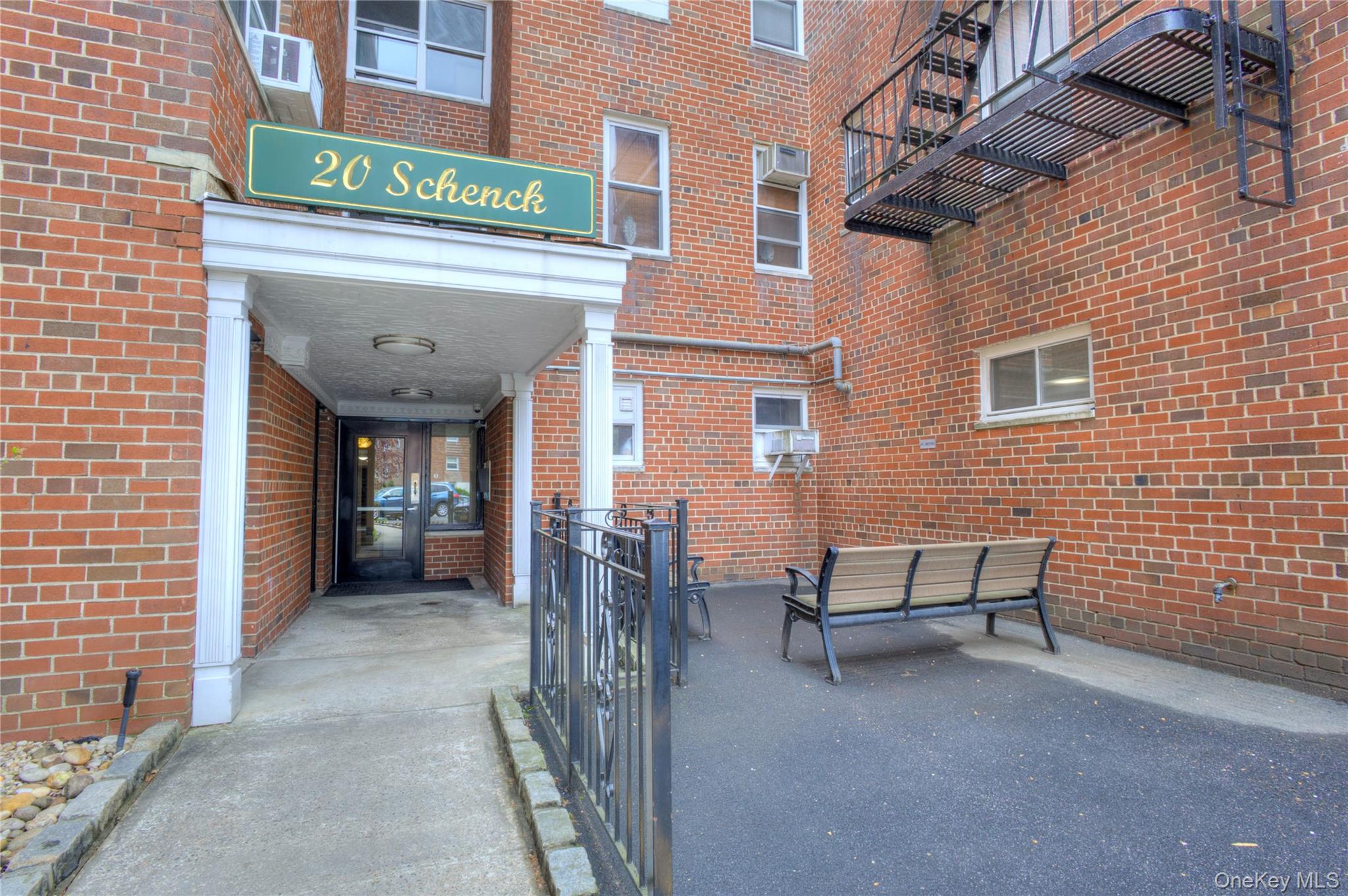 75 South Middle Neck Road, Unit 4G Great Neck, NY 11021 - Photo 24 of 37 a view of a brick building with many windows