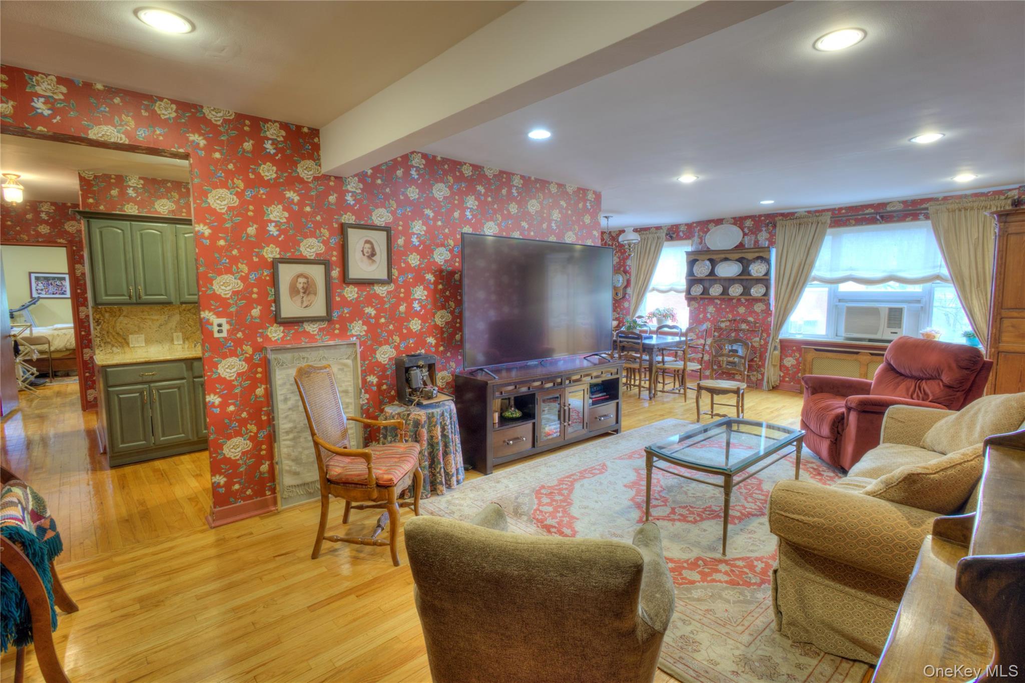 75 South Middle Neck Road, Unit 4G Great Neck, NY 11021 - Photo 5 of 37 a living room with fireplace furniture and a flat screen tv