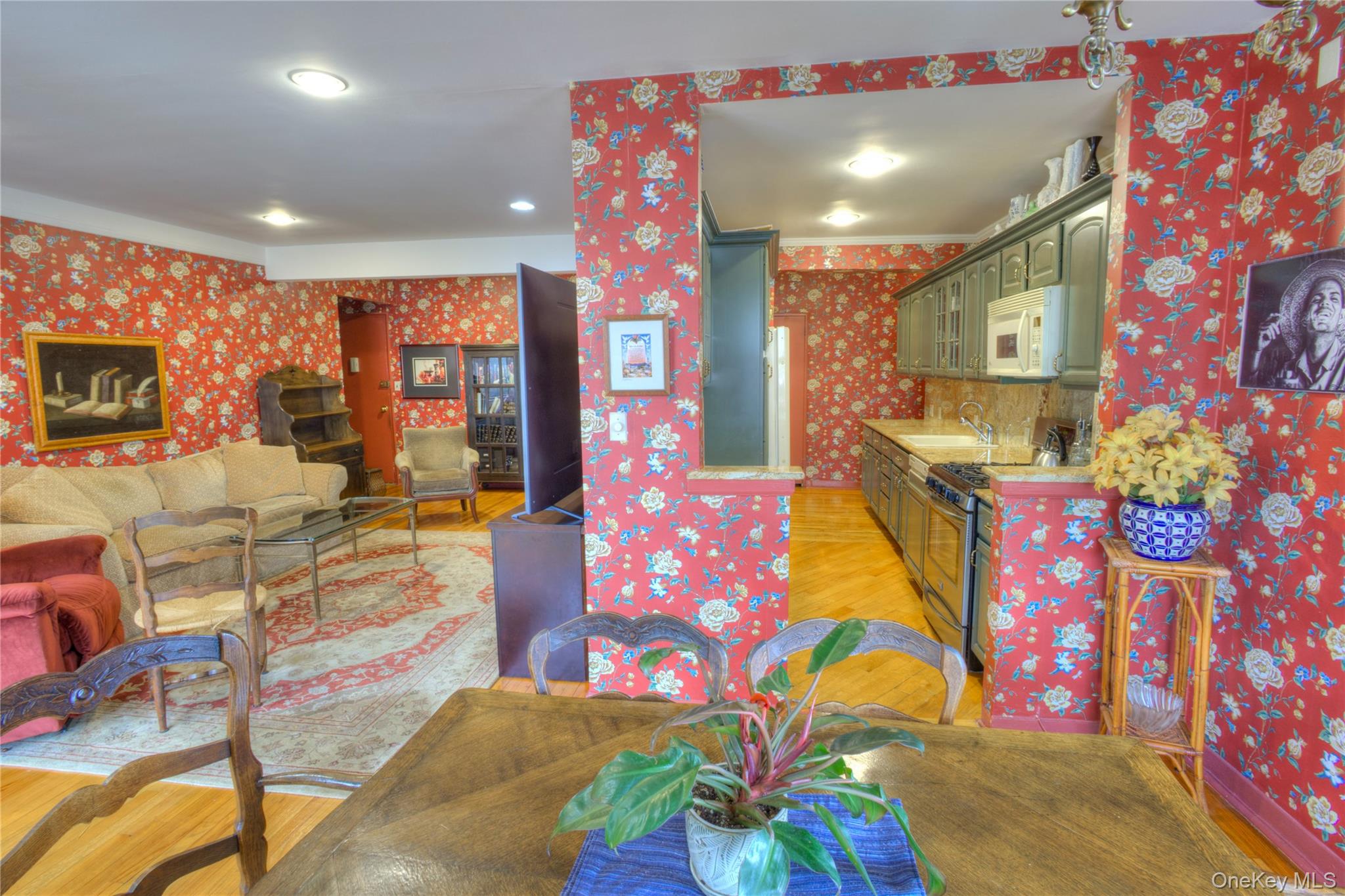 75 South Middle Neck Road, Unit 4G Great Neck, NY 11021 - Photo 9 of 37 a living room with fireplace furniture and a flat screen tv