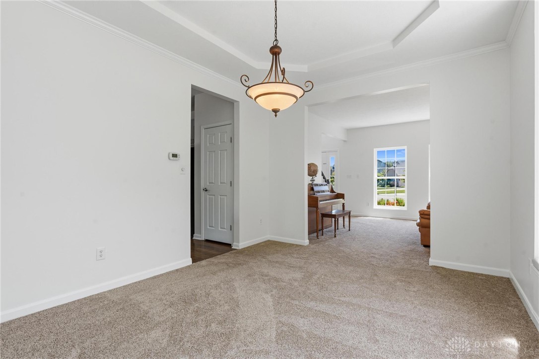 70 Martin Lane Springboro, OH 45066 - Photo 10 of 69 This versatile room features an elegant chandelier and plush carpeting, ideal for gatherings or tranquil moments.