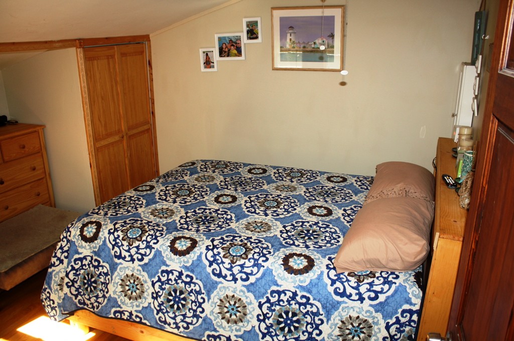 181 Main Road Gill, MA 01354 - Photo 11 of 13 a bedroom with a bed and a dresser