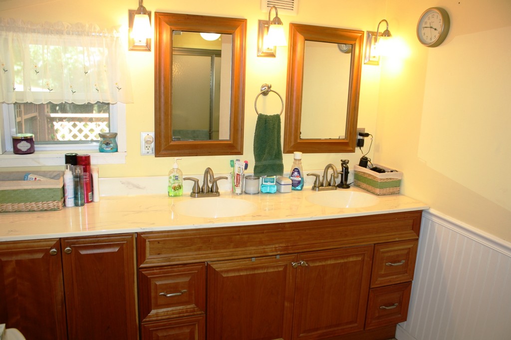 181 Main Road Gill, MA 01354 - Photo 13 of 13 a bathroom with a sink vanity granite and a mirror