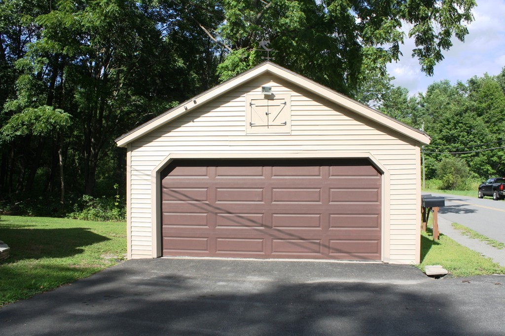 181 Main Road Gill, MA 01354 - Photo 4 of 13 a front view of a house with a yard