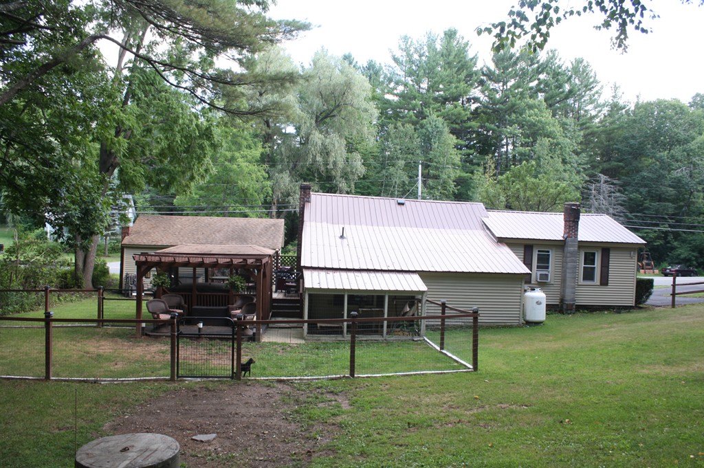 181 Main Road Gill, MA 01354 - Photo 5 of 13 a small garden covered with tall trees
