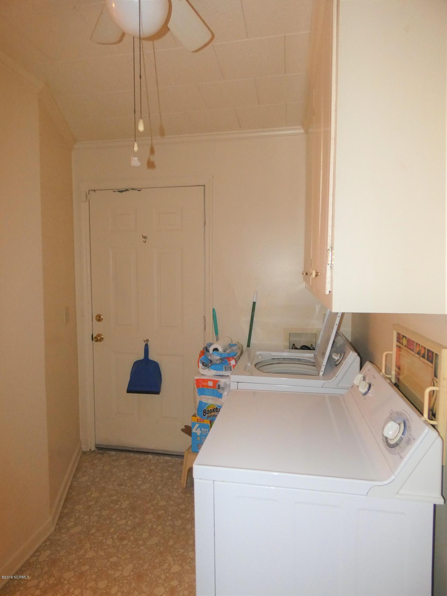 392 High House Road Clinton, NC 28328 - Photo 11 of 16 Laundry hall. Door leads to deck.