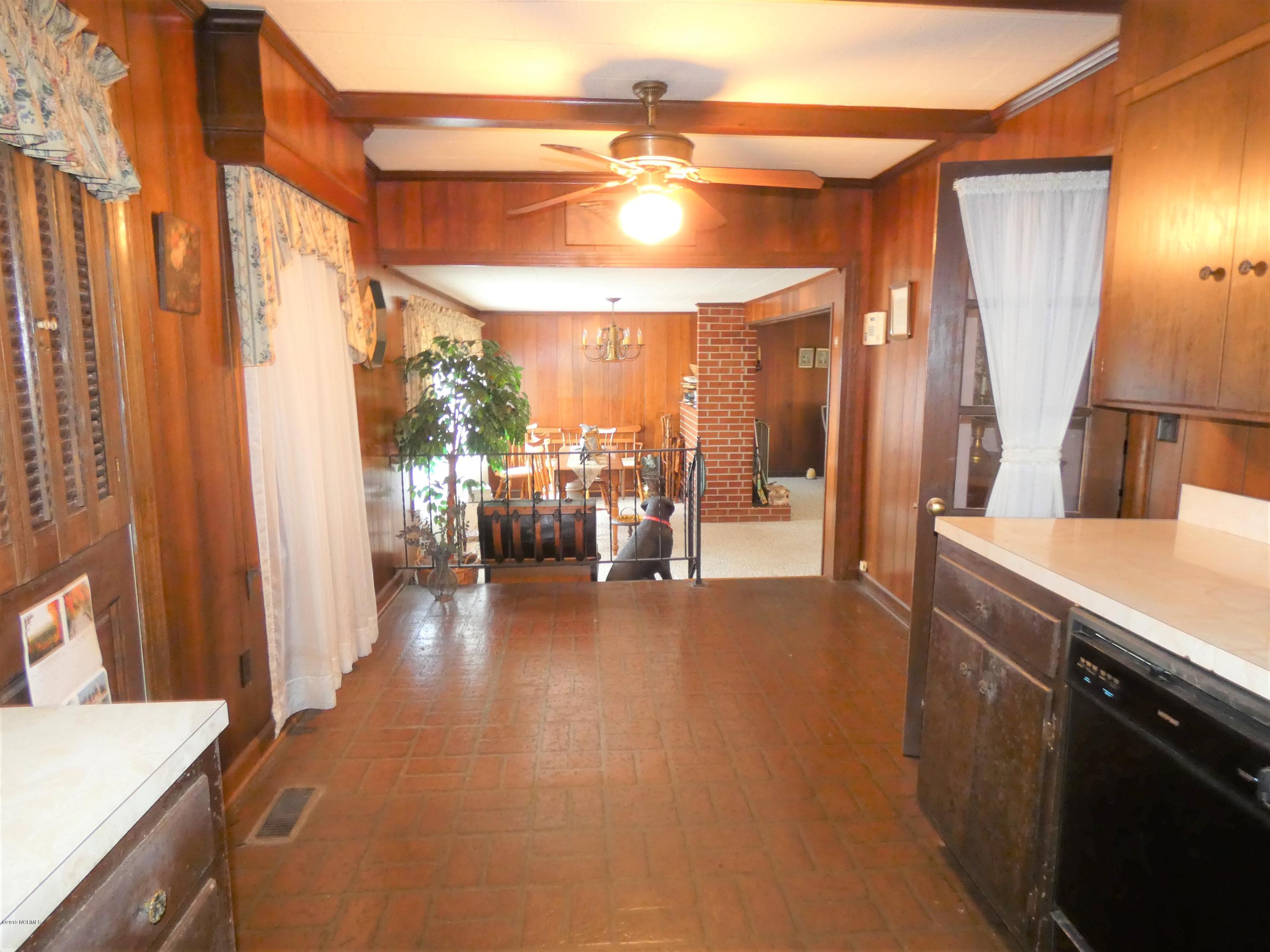 392 High House Road Clinton, NC 28328 - Photo 10 of 16 From kitchen looking towards dining room & den.