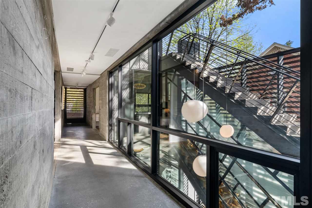 123 Hillcrest Road Raleigh, NC 27605 - Photo 11 of 30 board-formed concrete walls, and art gallery hanging system