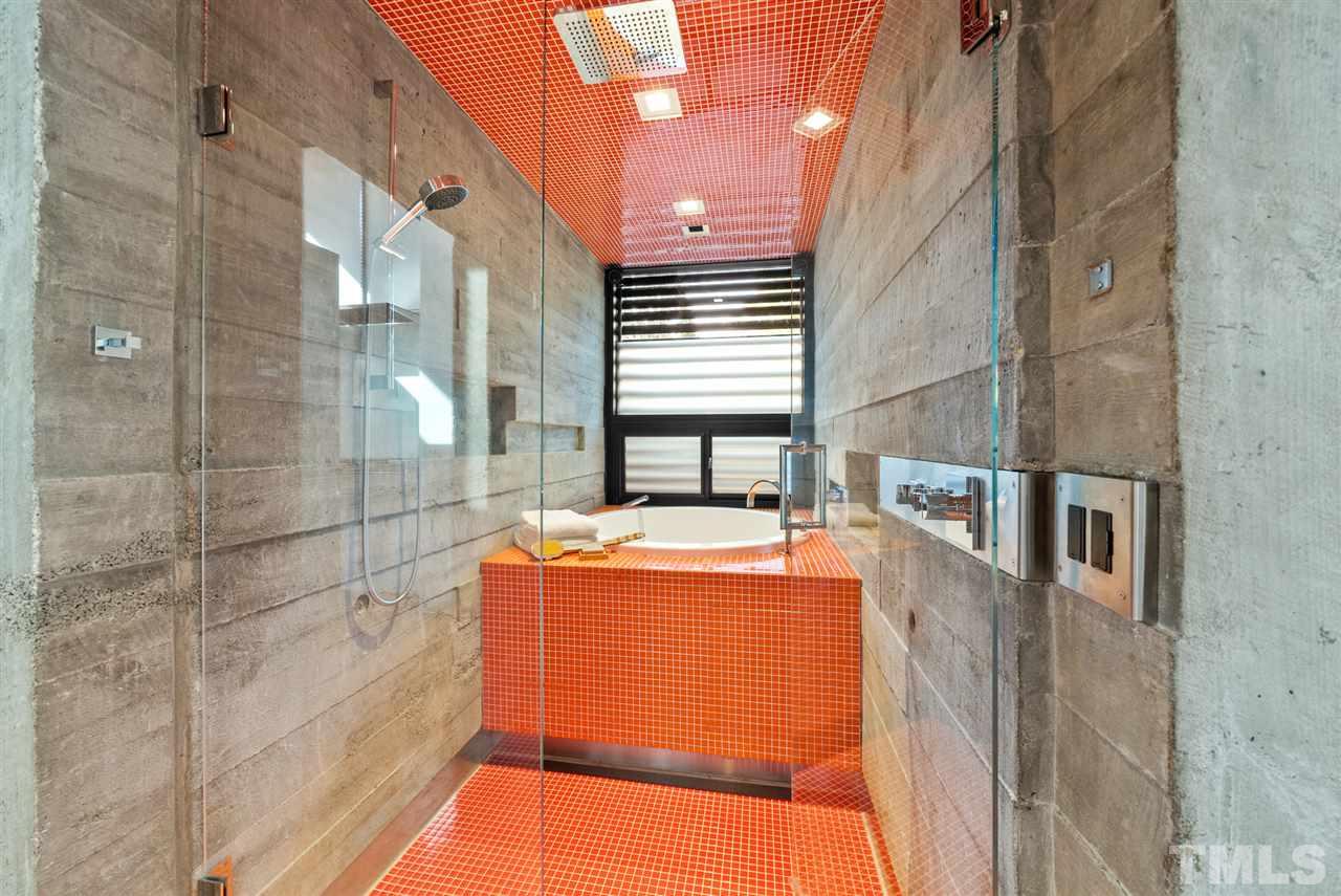 123 Hillcrest Road Raleigh, NC 27605 - Photo 14 of 30 japanese soaking tub and shower are located in the shower room, clad in square glass tile