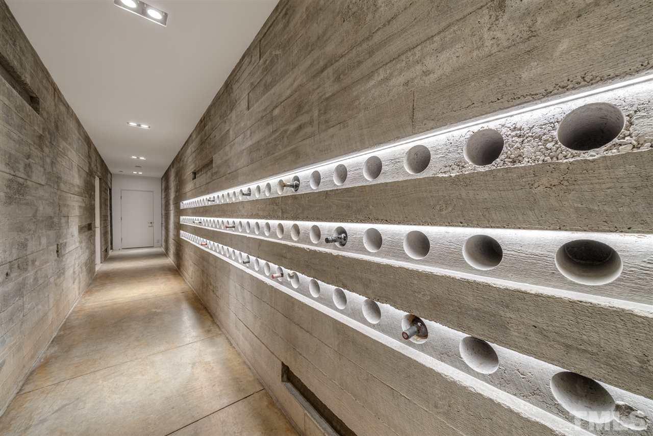123 Hillcrest Road Raleigh, NC 27605 - Photo 22 of 30 cast in place concrete wine cellar holds over 90 bottles