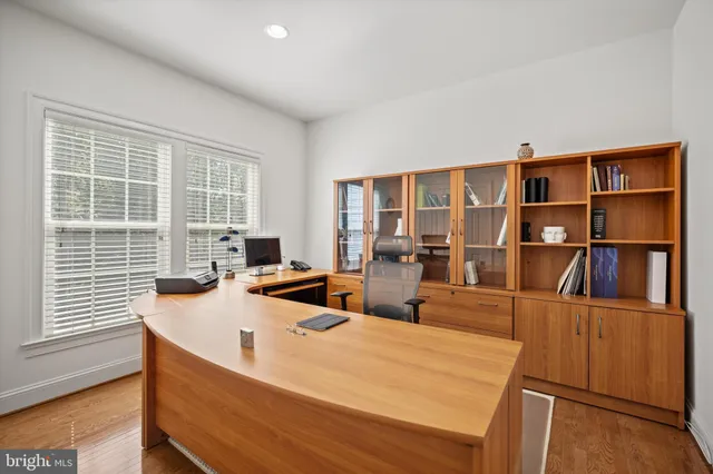 a living room with furniture window and wooden floor