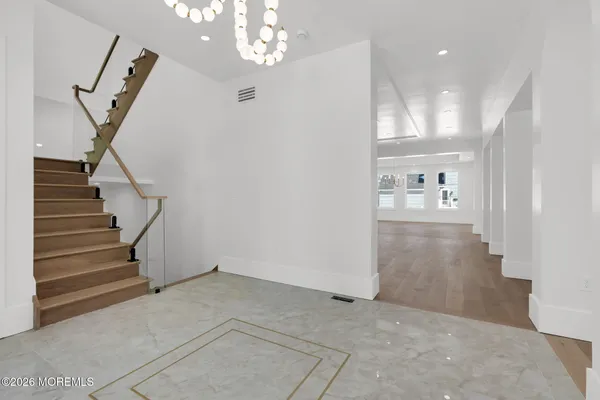 a view of an empty room with a fireplace