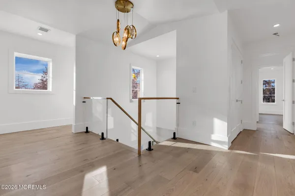a view of an entryway with wooden floor
