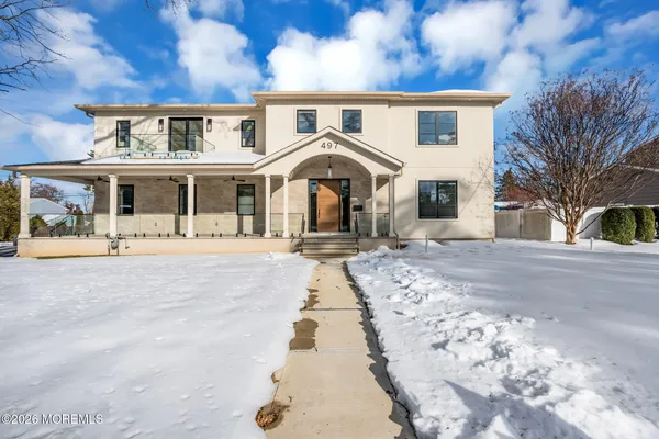 a view of a house with a snow in the yard