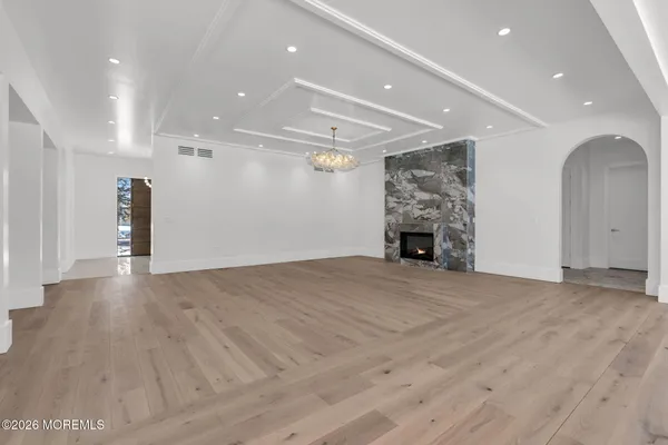 a view of an empty room with a fireplace