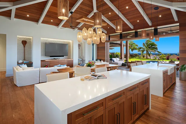 a kitchen with a sink and wooden floor
