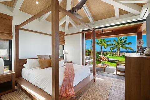 a bedroom with a bed and a table