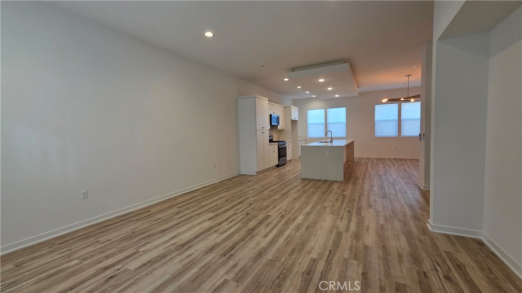 436 Village Brea Ca Brea, CA 92821 - Photo 11 of 26 a view of a kitchen with wooden floor