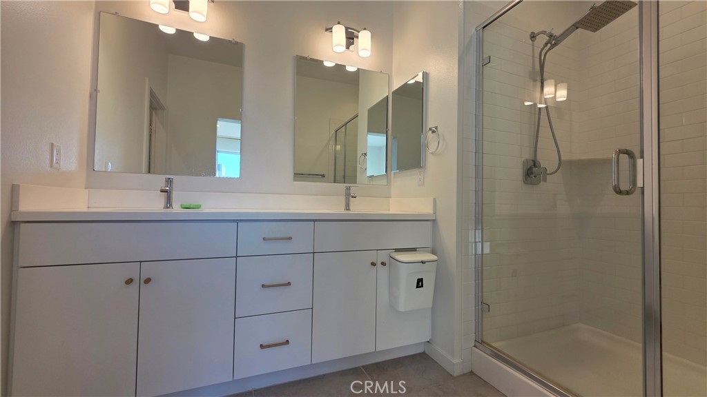 436 Village Brea Ca Brea, CA 92821 - Photo 15 of 26 a bathroom with a shower sink and mirror