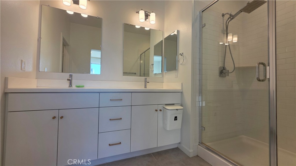 436 Village Brea Ca Brea, CA 92821 - Photo 18 of 30 a bathroom with a shower sink and mirror