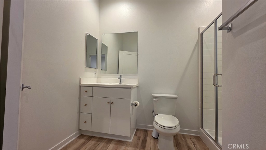 436 Village Brea Ca Brea, CA 92821 - Photo 20 of 30 a bathroom with a toilet sink and mirror