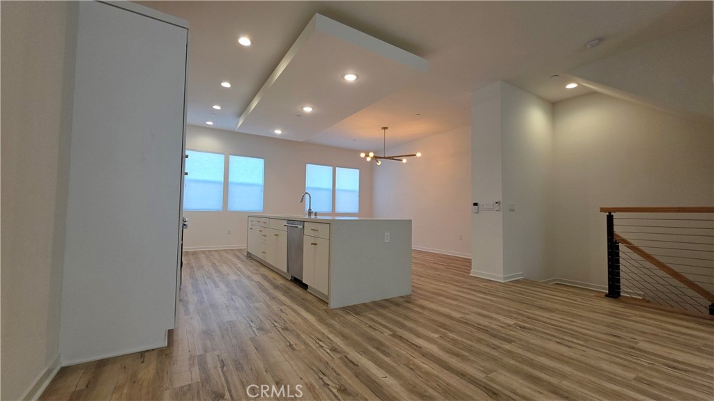 436 Village Brea Ca Brea, CA 92821 - Photo 6 of 26 an empty room with wooden floor and windows