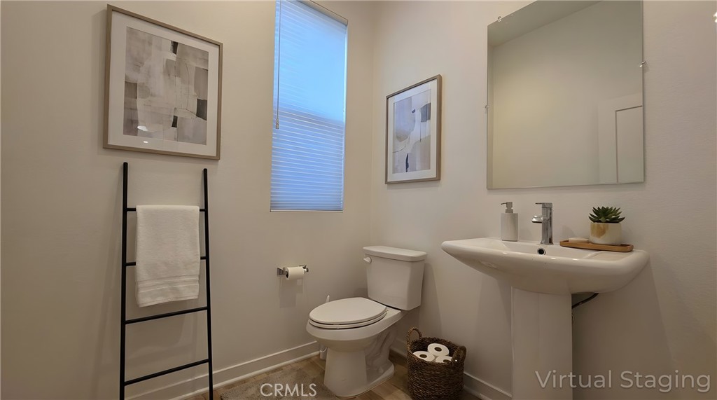 436 Village Brea Ca Brea, CA 92821 - Photo 7 of 30 a bathroom with a toilet sink and mirror