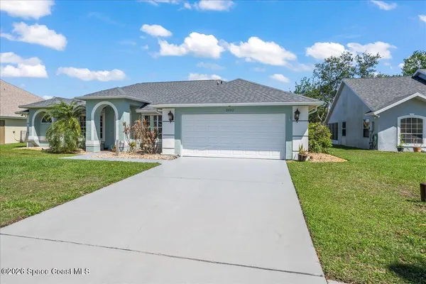 front view of a house with a yard