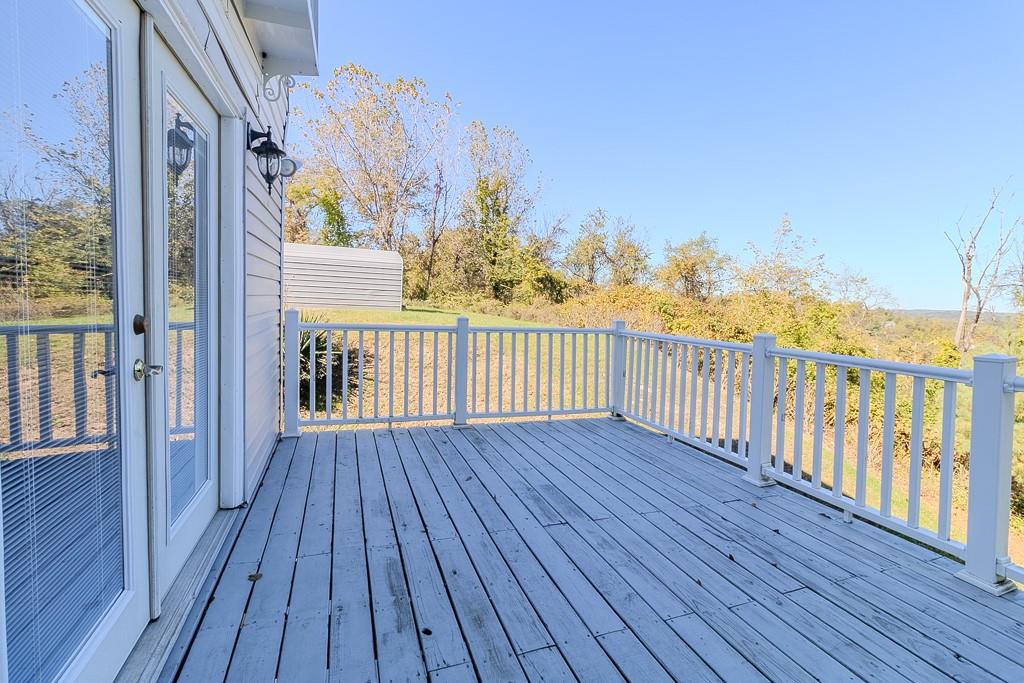 7583 Tyler Road Verona, PA 15147 - Photo 12 of 50 a view of a balcony with wooden floor