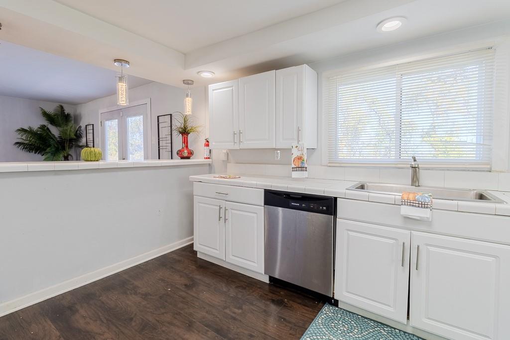 7583 Tyler Road Verona, PA 15147 - Photo 15 of 50 a kitchen with a sink cabinets and window