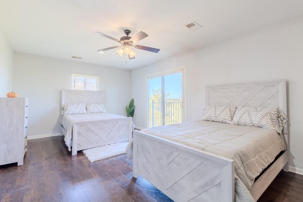 7583 Tyler Road Verona, PA 15147 - Photo 21 of 50 a bedroom with a bed and a chandelier