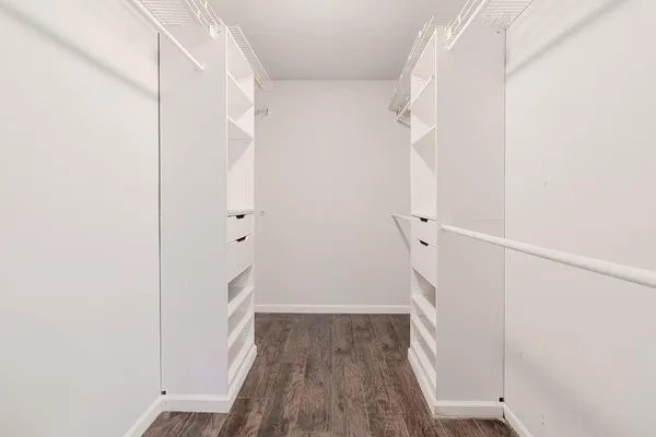 a view of hallway with wooden floor