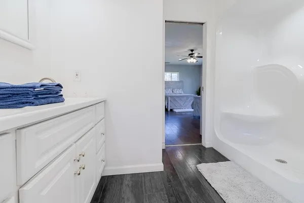 a view of hallway with wooden floor
